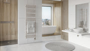 ICO Tuzio heated towel warmer styled in a modern bathroom